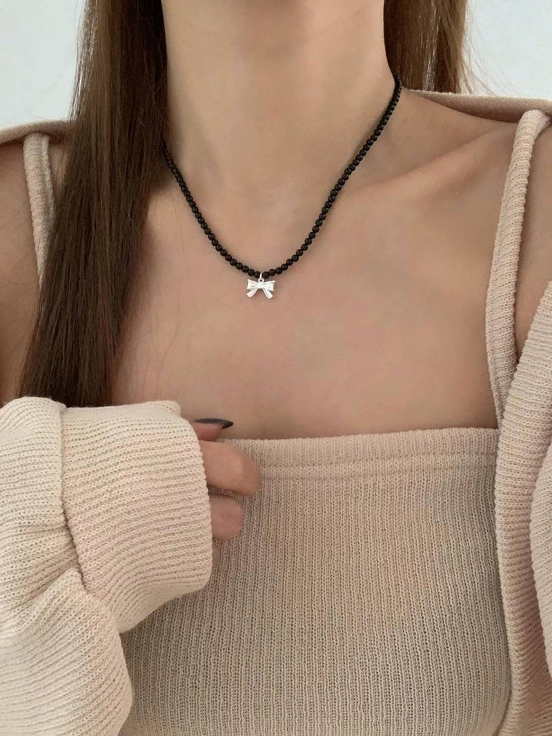 ONYX VOLUME RIBBON NECKLACE